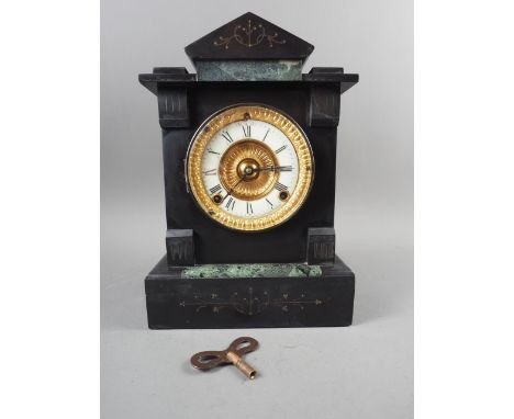 An early 20th century slate architectural clock with eight-day striking movement, 12" high,&nbsp;a brass anniversary clock wi