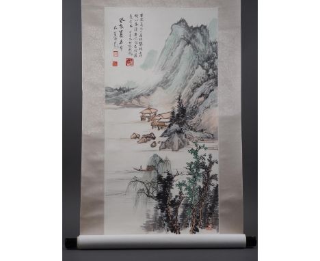 A Chinese watercolour scroll, mountains and water with boats and buildings, signed