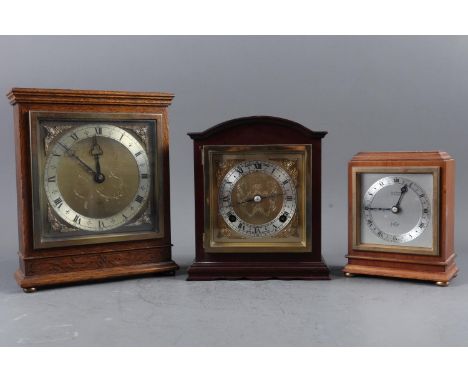 An Elliot walnut cased mantel clock for Garrard &amp; Co, two other Elliot mantel clocks