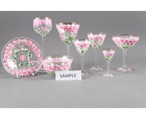 An early 20th century Continental glass table service with enamelled pink cabbage rose decoration and gilded rims, 72 pieces 