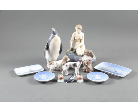 A Royal Copenhagen mermaid 4431, a penguin 412, a Pekinese 1238/1716, and other small Copenhagen models and pin trays (some c