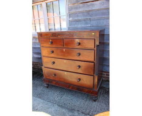 A 19th century mahogany and brass inlaid "Scotch" chest of two short and three long graduated drawers with knob handles and b