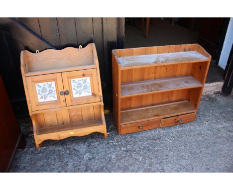 A pine wall shelf, fitted two drawers, and a pine shelf with cupboard enclosed two tile doors