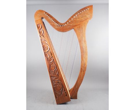 A mahogany harp with carved and engraved Celtic decoration, 35" high