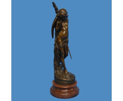After Auguste Louis Lalouette (French, 1826-1883), a brown patinated bronze figure of Cupid leaning on a rustic stump, impres