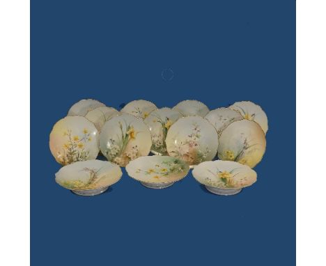 An early 20thC Royal Worcester hand-painted floral Cake Service, to include three Comports and eleven Plates, four repaired, 