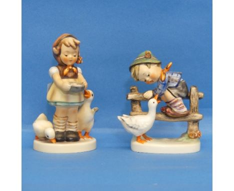 A pair of Hummel Figures, each depicting a young boy with birds, factory marks to base (2) 