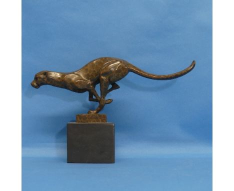 An Art Deco style bronze figure of a running Cheetah, on black marble base, W 30.5cm x H 19cm. 