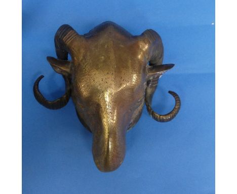 A patinated bronze Cow head wall mount, 23cm high x 19cm wide, together with a gilt-bronze Rams head wall mount, 18cm high x 