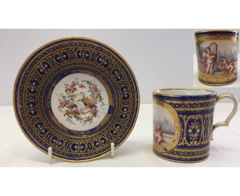 A Dresden cup and trembleuse saucer. Cup with hand painted panel depicting 3 cherubs playing musical instruments. Saucer hand