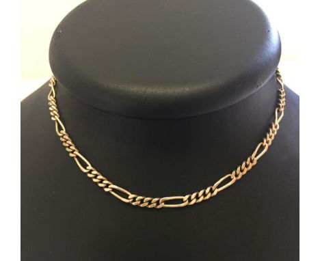 A 9ct gold necklace with safety chain. Measures 15 inches long, weight approx 17.7g.