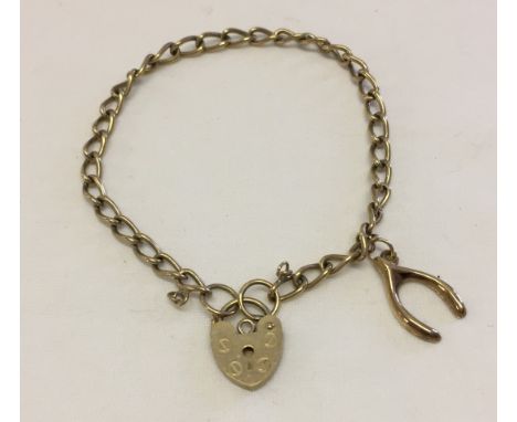 9ct gold charm bracelet with heart shape 'padlock' clasp (no safety chain), with a 9ct gold wishbone charm attached.  Total w