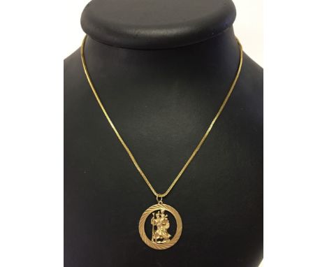 Open work St. Christophers medal pendant in 9ct gold (approx 2.5cm across), suspended on a good quality 9ct gold chain.  Tota