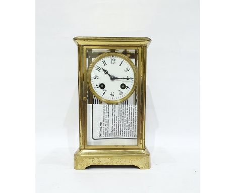 Brass and glass mantel clock with Arabic numerals to the enamel dial, mercury pendulum, with French mechanism 