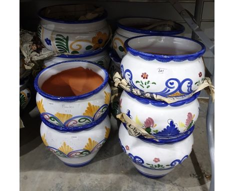 Eleven matching ceramic planters, various sizes 