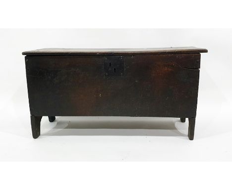 18th century oak six-plank chest, the rectangular top with carved edge decoration, iron ring hinges