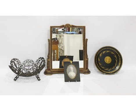 Gilt and black metal shallow dish decorated with Medusa head, a gilt and stained wood easel mirror, an Eastern scrolled metal