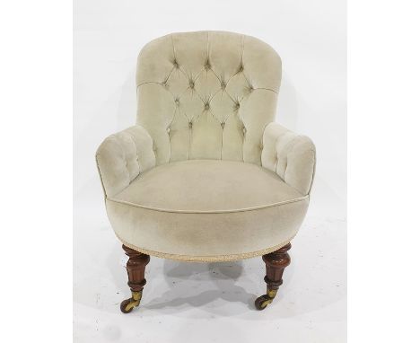 Late Victorian button-back grey upholstered chair on turned and carved supports, to brass caps and brown china castors 