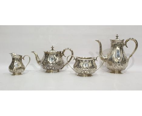 Late Victorian silver tea and coffee service with Art Nouveau decoration of stylised flowers trailing tendrils, comprising te