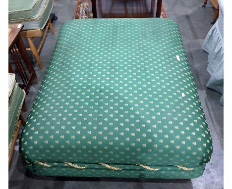 Large pouffe on green ground bee-pattern upholstery, on four bun feet