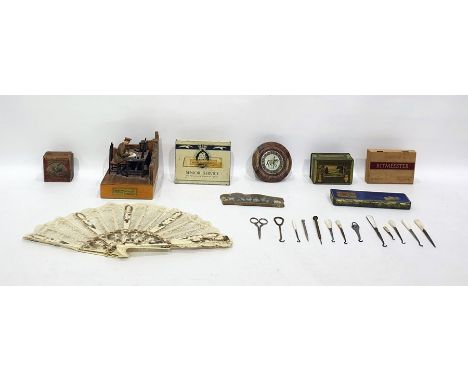 Metal and wooden model scene of WWI army officer seated writing a letter, with electrical lighting below, tins, boxes, agate 