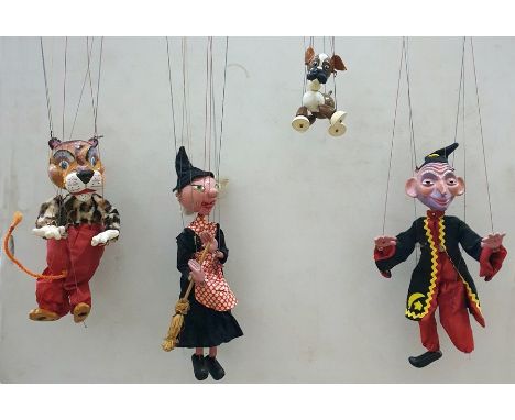 Pelham puppet 'Tiger' with leopard print top, green scarf, red trousers and having Pelham label, Pelham puppet witch, 'Benjie