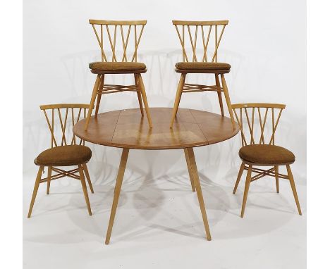 Light elm Ercol dropleaf dining table raised on beech supports and&nbsp;four Ercol Windsor candlestick lattice elm seated and