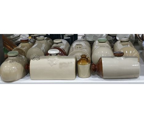 Quantity of stone footwarmers, one marked William Dibben Furnishing Ironmonger, Southampton, another Butler &amp; Sons, Westb