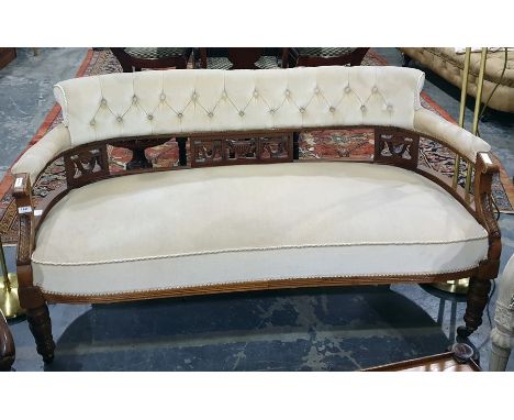 19th century mahogany framed sofa with cream ground button-back, cream upholstered seat, carved decoration, ringed and turned