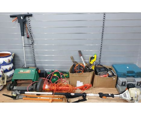 Collection of electric and other garden equipment including stihl long reach hedge trimmer, electric chainsaw, electric strim