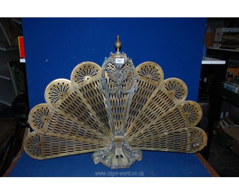 A folding Peacock fire screen.