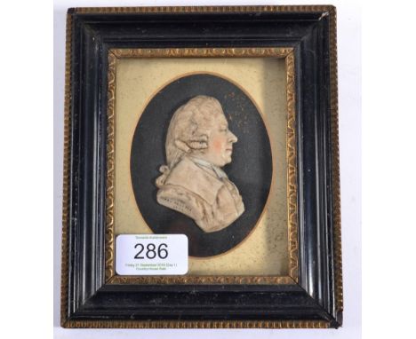 James Beattie: A Wax Relief Bust Portrait of a Gentleman, dated 1787, his hair en queue, wearing a coat, inscribed to the tru