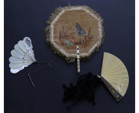 Three Fans: A 19th century ivory Carnet de Bal, with six ivory sticks, both guards of mother-of-pearl, a silver metal decorat