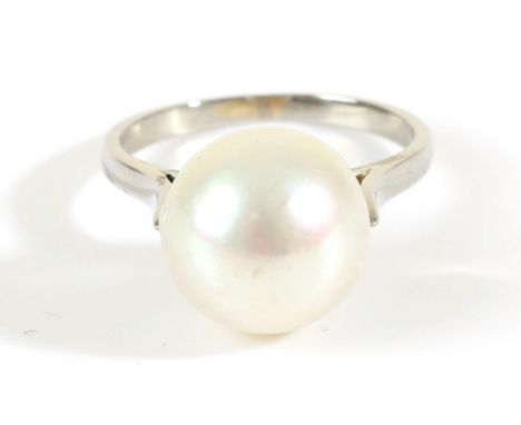 A Cultured Pearl Ring, to knife edge shoulders, finger size K .  The ring is in good condition. It is not hallmarked or stamp