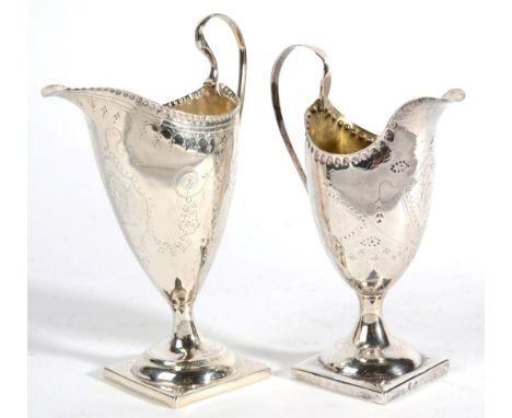 Two Similar George III Silver Helmet Shaped Pedestal Cream Jugs, maker's mark WS, London 1789; and maker's mark RJ, probably 