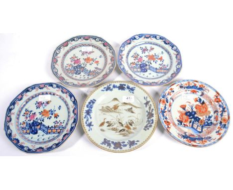 A Set of Three Chinese Porcelain Octagonal Plates, Qianlong, painted in underglaze blue and colours with a fenced garden with