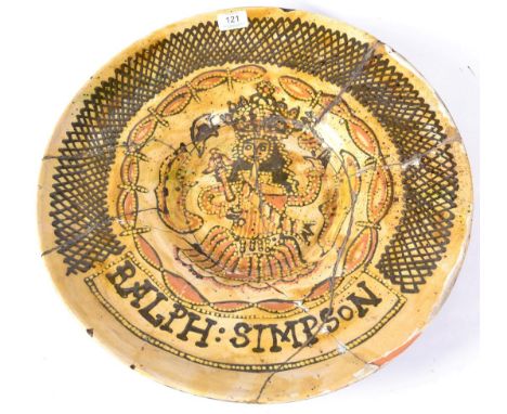 A Slipware Charger, in 17th century style, trailed in coloured slips with a portrait of King William within a lattice border 