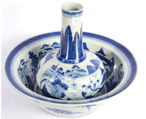 A Chinese Porcelain Guglet and Basin, circa 1800, painted in underglaze blue with river landscapes within formal leaf and dia