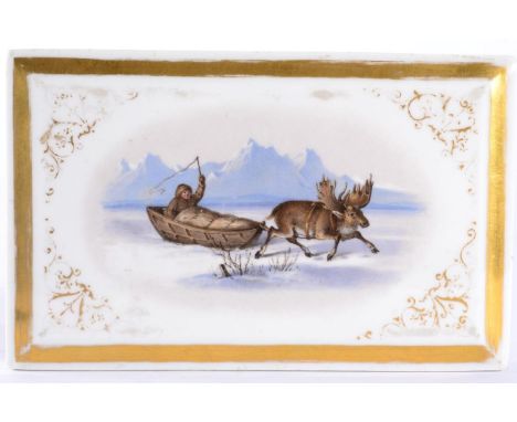 A Russian Porcelain Paperweight, circa 1860, of rectangular form, painted with an elk pulling an Inuit in a sled within gilt 