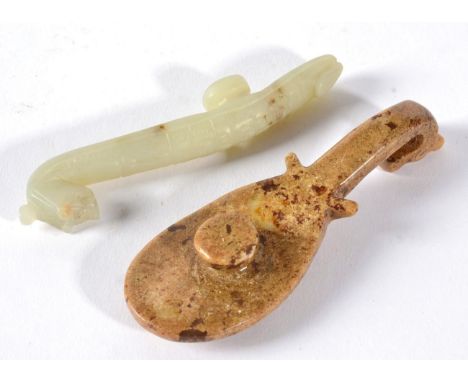 A Chinese Jade Belt Hook, in the form of a dragon, 11cm long; and Another Belt Hook, with dragon terminal and scroll carving,