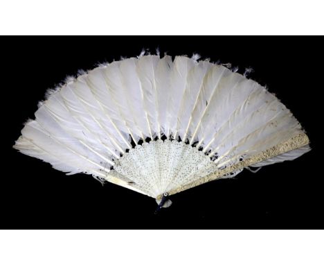 A 19th Century Carved Ivory Chinese Fan with White Feathers, Qing Dynasty. The guards are deeply carved with figures, buildin