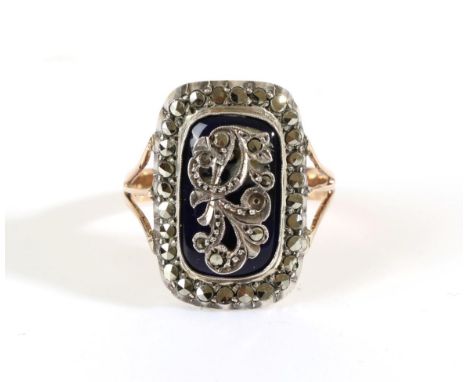 A Georgian Marcasite and Blue Enamel Ring, an oblong plaque with applied marcasite floral scroll, to a blue enamel ground, wi