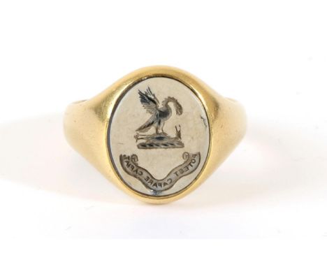 An 18 Carat Gold Sardonyx Intaglio Signet Ring, an oval intaglio seal engraved with heraldic emblem and motto, finger size M 