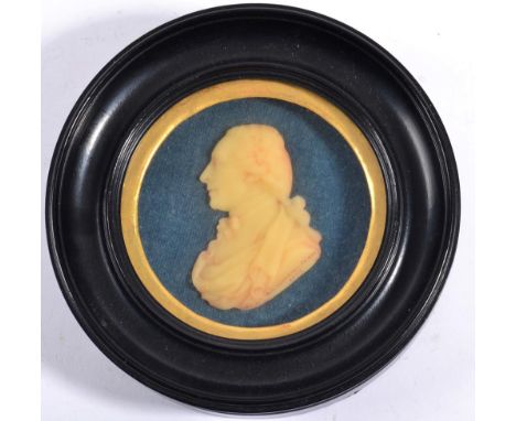 V S Buchanan (Scottish, late 18th century): A Wax Relief Bust Portrait of a Gentleman, his hair en queue, wearing a cloak and