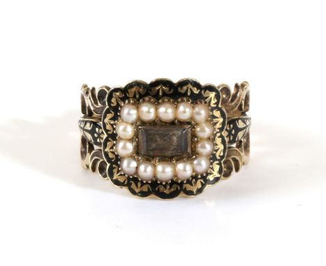 A Georgian Mourning Ring, a central rectangular plaque containing hairwork, within a border of seed pearls and black enamel, 