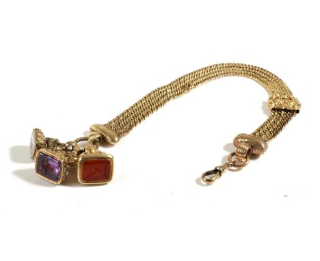 An Albertina with Three Intaglio Fob Seals, a multi-strand albertina, with a floral cast slider and clip, suspending three in