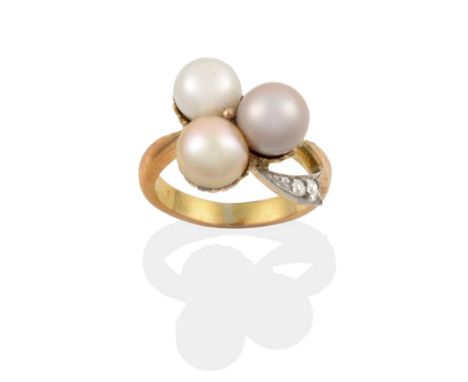 A Circa 1900 Pearl and Diamond Clover Ring, white, grey and gold coloured pearls with a diamond set stem, finger size K .  Th