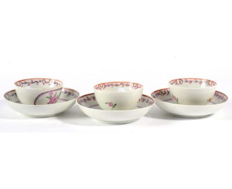 A Set of Three Lowestoft Porcelain Tea Bowls and Saucers, circa 1790, painted in colours with flower sprigs within foliate me