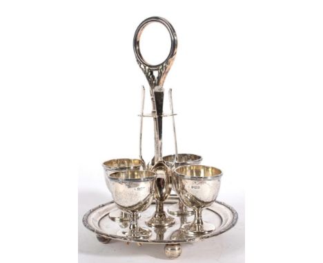 A Silver Egg Cruet, William Hutton & Sons, Sheffield 1918, the associated spoons Sheffield 1933, circular with reed and ribbo