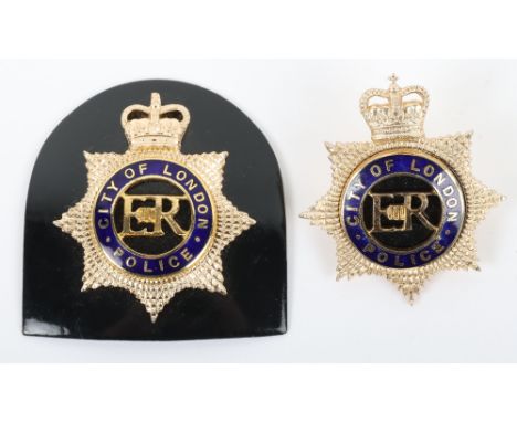 Obsolete City of London mounted officers Cap Badge, Queens crown, EIIR gilt/blue enamel two piece badge, mounted on black met